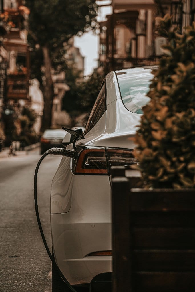 Premium EV charger hardware close-up in a luxury garage setting