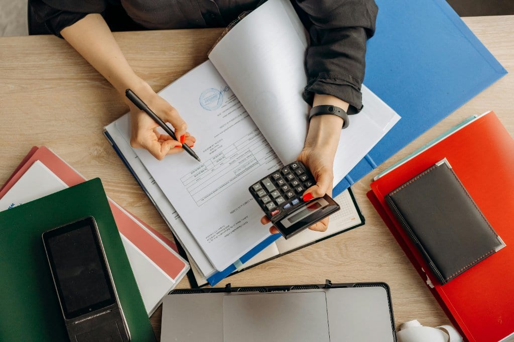 Refined paperwork and financial planning scene for a Hamptons solar project